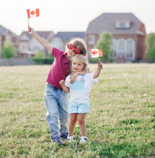 girl-and-boy-siblings-waving-canadian-flags-kids-2021-09-21-17-41-08-utc girl-and-boy-siblings-waving-canadian-flags-kids-2021-09-21-17-41-08-utc
